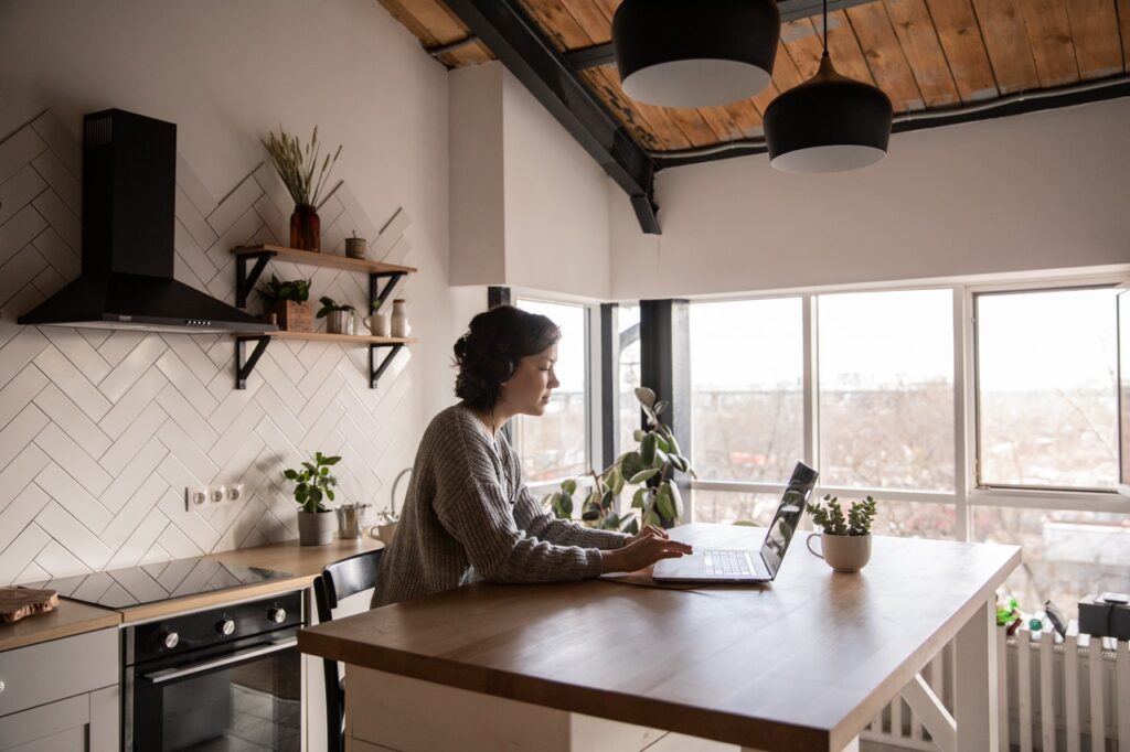 Woman using a laptop on a table