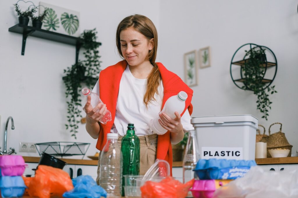 Woman sorting bottles for recycling.